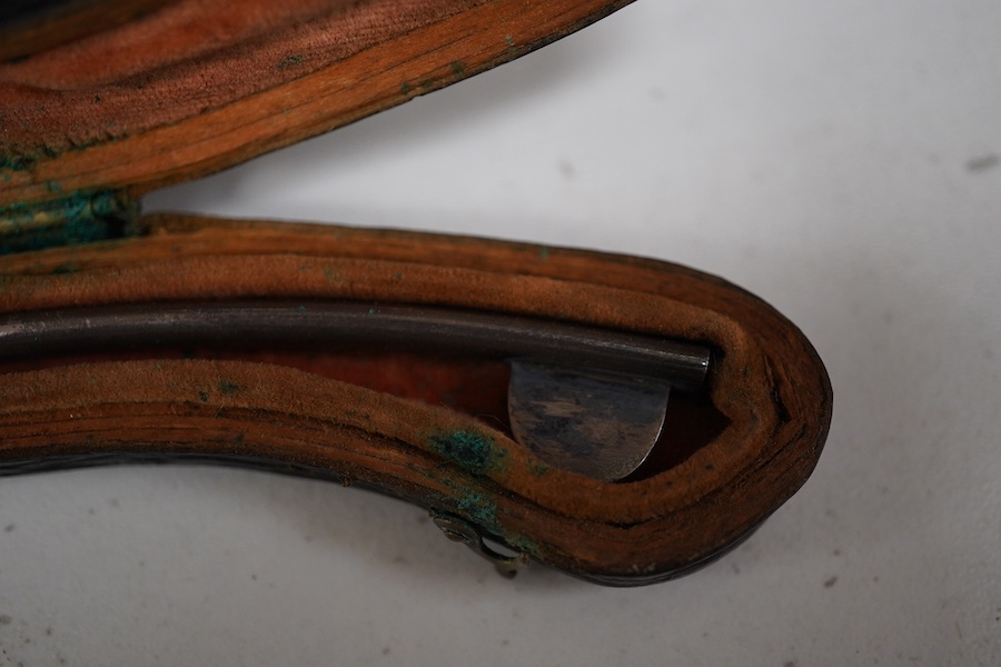 A late 19th century leather cased medical set of catheter surgical instruments, together with a single leather case catheter, plus an early 20th century canvas roll containing a graduated set of gynaecological surgical i